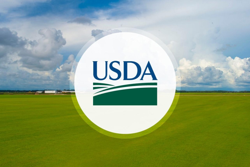 USDA logo against a green field and blue sky